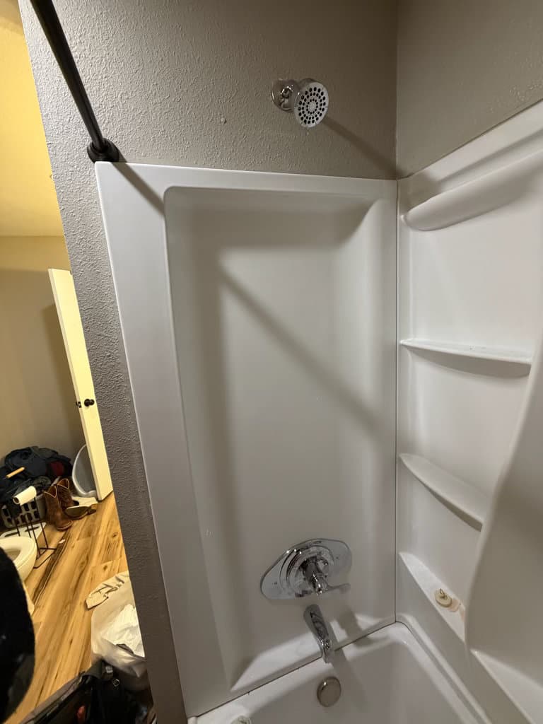 After: completed shower and tub with new valve trim, tub spout, and shower head installed by Oopsie Daisy Plumbing, Northern Colorado