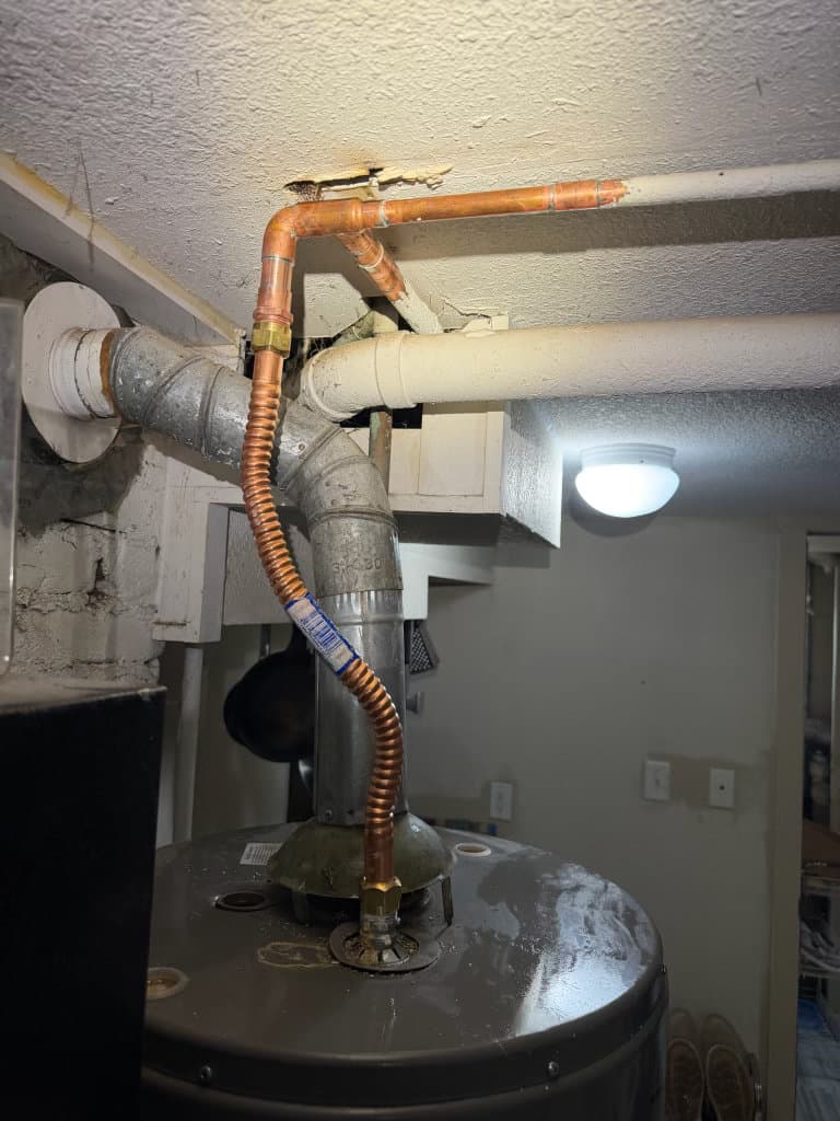 After: water heater re-piped with bright new copper supply connections — Oopsie Daisy Plumbing Northern Colorado